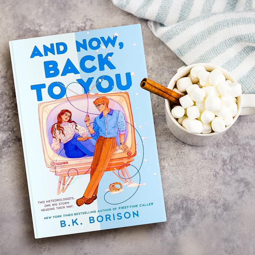 And Now, Back to You by BK Borison on a gray background next to a mug of marshmallows